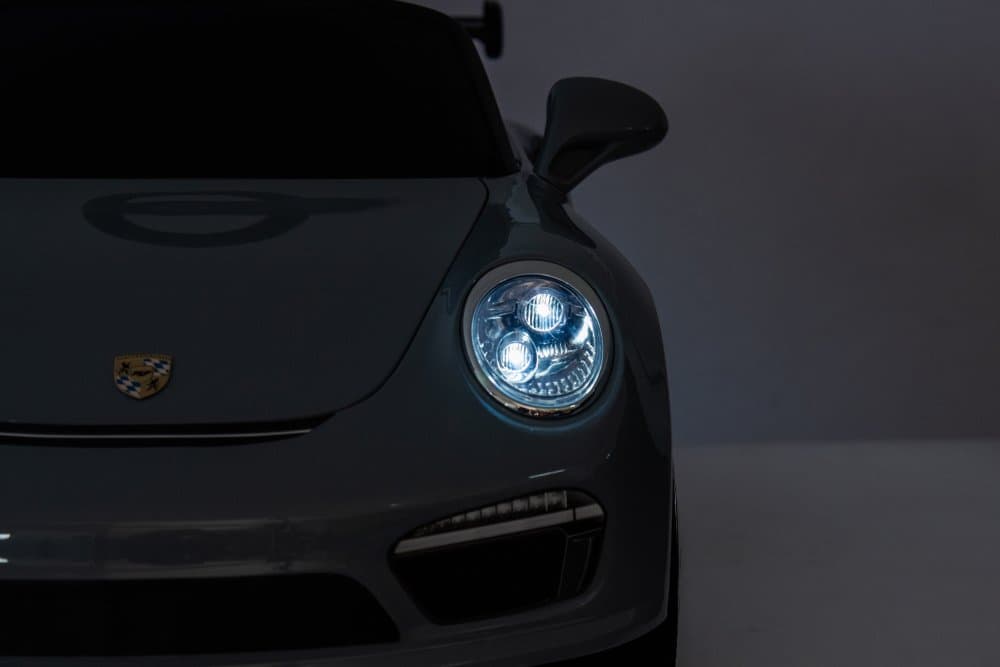 Masinuta electrica pentru copii Porsche RUF CTR3 Blue 70w cu licenta,echipare premium,roti EVA,scaun din piele,oglinzi retrovizoare,lumini LED,muzica,bluetoothUSB,suspensii,cod QR video asamblare,afisaj baterie,Eleron